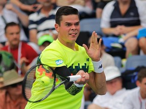 Milos Raonic hits a return to Victor Estrella Burgos of Dominican Republic during their third round match at the U.S. Open in New York on Saturday, Aug. 30, 2014. (Eduardo Munoz/Reuters/Files)