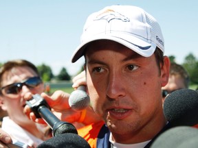 Denver Broncos NFL football starting quarterback Kyle Orton talks to reporters after the team's first practice at training camp in Denver July 28, 2011. (REUTERS/Rick Wilking)