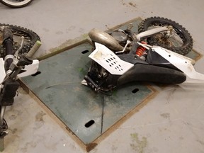 A dirt bike is damaged following a fatal collision in Sylvan Lake, AB that left one man dead and another in hospital with critical injuries. PHOTO SUPPLIED