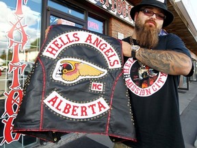 Hells Angels member, Moose, isn't too pleased how the police have singled them out when they go out to bars or concerts in Calgary, Alta. on Saturday, Aug. 30, 2014. Darren Makowichuk/Calgary Sun/QMI Agency
