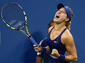 Eugenie Bouchard of Canada celebrates defeating Barbora Zahlavova Strycova of the Czech Republic during their women's singles match at the 2014 U.S. Open tennis tournament in New York August 30, 2014. (REUTERS/Adam Hunger)