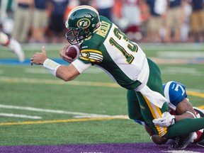 Mike Reilly is tackled during a game against the Alouettes in Montreal on Saturday August 8 2014.
JOEL LEMAY/AGENCE QMI