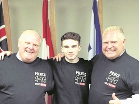East York clothing designer Oliver Nixon, 18, flanked by Mayor Rob Ford, left, and Doug Ford wearing his shirts.
