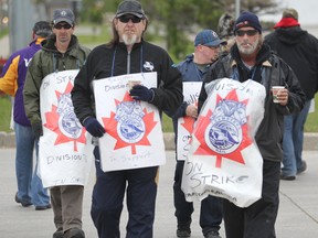 Striking CP workers walk the picket line on Jarvis Ave near McPhillips Street Station Casino, a national strike began today.  Wednesday, May 23, 2012. Manitoba’s labour laws are more lopsided in favour of unions than any other province in Canada, a new report from the Fraser Institute shows.
(Chris Procaylo/Winnipeg Sun/QMI Agency files)