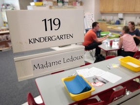 Kindergarten teachers Louise Ledoux, Jesse Gervais and Ricjelle Francey prepare Friday, Aug. 29, 2014 for their first day of school at Berrigan Elementary School. Tony Caldwell/Ottawa Sun/QMI Agency