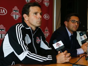 Toronto FC general manager Tim Bazbatchenko (R) announces that Greg Vanney (L) would be taking over the reigns of head coach after Ryan Nelsen was released on Sunday August 31, 2014. (Jack Boland/Toronto Sun)