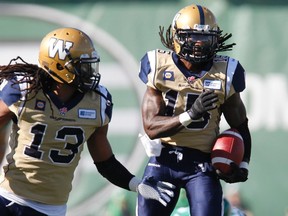 Winnipeg Blue Bombers defensive back Troy Stoudermire (R) returns kick for a touchdown run while playing against the Saskatchewan Roughriders during the second half of the Classic Labour Day CFL football game in Regina, Saskatchewan August 31, 2014. The Riders won the game 35-30. (REUTERS/David Stobbe)