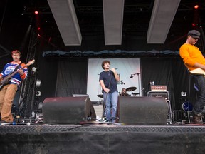 Vocalist Mike Caldwell (centre), bass player Corb Lund (left), guitarist Dug Bevans (right) and drummer Terry Johnson of The Smalls perform during Sonic Boom 2014 at Northlands in Edmonton, Alta., on Sunday, Aug. 31, 2014. The band reformed in May 2014. Ian Kucerak/Edmonton Sun file