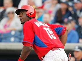 Philadelphia Phillies right fielder John Mayberry Jr. (15) hits a solo home run during the fifth inning against the New York Yankees at Bright House Field in Clearwater, Fla., on March 6, 2014. Mayberry was traded to the Toronto Blue Jays on Aug. 31, 2014. (KIM KLEMENT/USA TODAY Sports files)
