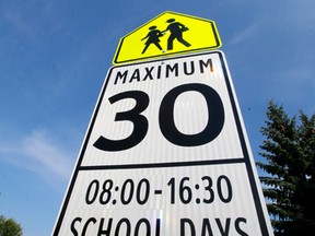 A school zone sign outside St. Martha Catholic School at 7240-180 Street in Edmonton. (Tom Braid/Edmonton Sun)