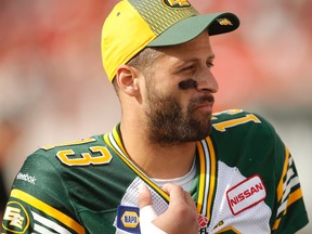 Eskimos quarterback Mike Reilly spent Monday's game against the Stampeders on the sidelines at McMahon Stadium in Calgary. (Al Charest, QMI Agency)