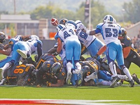 Tiger-Cats QB Jeremiah Masoli fumbles the ball on the one-yard line during Monday’s Labour Day Classic against the Argos in Hamilton. (JACK BOLAND/Toronto Sun)