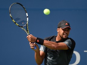 Jo-Wilfried Tsonga returns lost to Andy Murray at the U.S. Open on Monday. (USA TODAY Sports)