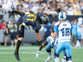 Ticats Erik Harris (41) tries too block Argos QB Rick Ray pass in the first quarter of the Labour Day Classic at Tim Hortons Field in Hamilton Monday September 1, 2014. (Jack Boland/Toronto Sun)