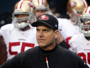 San Francisco 49ers head coach Jim Harbaugh waits to take the field before the 2013 NFC Championship football game against the Seattle Seahawks at CenturyLink Field. (Joe Nicholson-USA TODAY Sports)