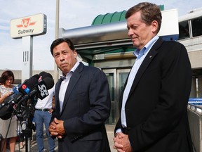 Liberal MPP Brad Duguid (L) was at Kennedy TTC subway station on Tuesday September 2, 2014 and gave his own personal endorsement to Toronto mayoral candidate John Tory on becoming the next mayor of Toronto.  Jack Boland/Toronto Sun/QMI Agency