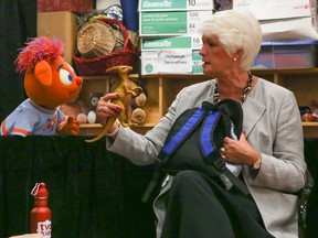 Ontario Minister of Education Liz Sandals along TVO puppet friend Opie attend Our Lady of Lordes Catholic School in Toronto on Tuesday, September 2, 2014. (Dave Thomas/Toronto Sun)