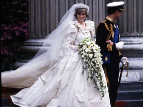 Diana, Princess of Wales, wearing an Emanuel wedding dress, and Prince Charles, Prince of Wales leave St. Paul's Cathedral following their wedding on July 29, 1981. (Anwar Hussein/WENN.COM)
