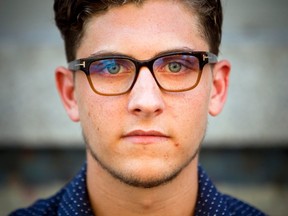 Simeon Garratt, son of Canadian couple Kevin and Julia Dawn Garratt who are being investigated in China for threatening national security, talks to a Reuters journalist outside of his residence in Vancouver, British Columbia August 5, 2014. (REUTERS/Ben Nelms)