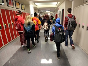 Students hurry to class on the first day of school at Victoria School of the Arts in Edmonton, Alberta on September 2, 2014. Perry Mah/Edmonton Sun/QMI Agency