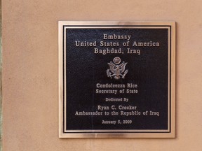 A commemorative plaque hangs on the Chancellery wall inside the compound of the U.S. embassy in Baghdad in this December 14, 2011, file photo. (REUTERS/Lucas Jackson/Files)