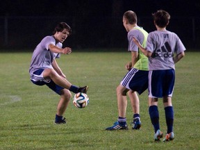 Matt Paquette tries to put a move on Anthony Cimino as Connor O?Neil-Young watches during practice with the North London Elite U14 boys? soccer team on Tuesday. The team is in the Ontario Cup final against Oakville in Oshawa on Saturday. (DEREK RUTTAN, The London Free Press)