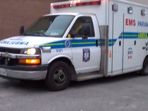 YouTube screen capture
Paramedics respond after a pair of men were found passed out in a parking lot off Lisgar Street in this still image from a video shot by Marcel St-Jean of Sudbury.