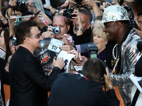 Bono meets with fans in Toronto. (MICHAEL PEAKE/QMI AGENCY files)