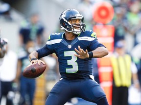 Seahawks quarterback Russell Wilson passes against the Bears during pre-season NFL action in Seattle on Aug. 22, 2014. (Joe Nicholson/USA TODAY Sports)
