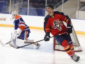 Aaron Ekblad, takes a shot at goalie Laurent Brossoit at the Mattamy Athletic Centre on August 23, 2014 in Toronto for the 2014 NHLPA Rookie Showcase. (Veronica Henri/Toronto Sun/QMI Agency)