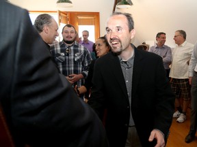 Councillor Bryan Paterson greets supporters on Wednesday before announcing his intention to run to be the mayor of Kingston. (Ian MacAlpine/The Whig-Standard)