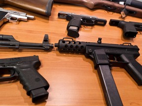 A display of guns that were seized during Project "Sleepwalker" at a press conference announcing the conclusion of the 18-month drug investigation. Thursday December 8,2011. (ERROL MCGIHON/THE OTTAWA SUN/QMI AGENCY).