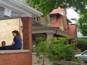 Jason and Kate Ahrens live on Dufferin St. and participate in a historical project that identifies the people who first lived in the old homes in London?s Old East Village. (MIKE HENSEN, The London Free Press)