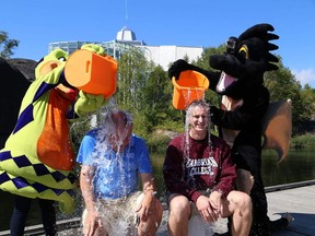 JOHN LAPPA/THE SUDBURY STAR/QMI AGENCY
College Boreal president Pierre Riopel, left, and Cambrian College president Bill Best take part in the ALS Ice Bucket Challenge on the dock at Science North in Sudbury, ON. on Wednesday, September 3, 2014. As part of the challenge, faculty and staff are encouraged to donate to ALS Canada, as well as to student food banks at both campuses.