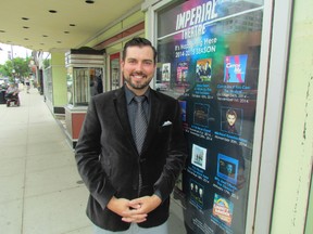 Brian Austin Jr., manager of the Imperial Theatre in downtown Sarnia, leans on a poster for its 2014-15 season of shows and concerts. Tickets for the new season are on sale at the box office.
(PAUL MORDEN/ SARNIA OBSERVER)