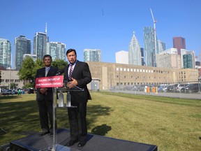 Economic Development Minister Brad Duguid, right, with LCBO president Bob Peters, said his party  is now entertaining bids from developers to purchase an 11-acre site owned by the LCBO on Sept. 4, 2014. (JACK BOLAND/Toronto Sun)