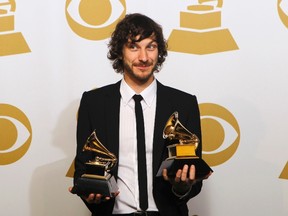 Gotye poses with the awards he won for Record of the Year and Best Pop Duo/Group Performance for "Somebody That I Used to Know."  (REUTERS/Mario Anzuoni)