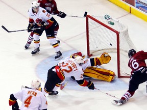 Brody Milne fires the puck past Belleville Bulls goalie Charlie Graham on Oct. 12, 2013 at the Yardmen Arena in Belleville. The Sudbury Wolves acquired Milne from the Windsor Spitfires on Thursday.