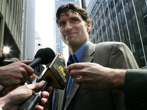Steve Moore is surrounded by reporters after leaving NHL headquarters in New York, April 26, 2005. Moore was at a hearing for Vancouver Canucks forward Todd Bertuzzi, whose blindside punch to Moore's head in 2004 permanently knocked the Colorado Avalanche player out of hockey. (REUTERS)