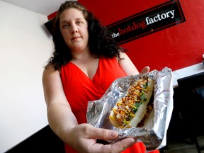 Tonya Woodward, owner of the downtown joint The Hot Dog Factory, is shown in the restaurant here Thursday, Sept. 4, 2014. 
Emily Mountney-Lessard/The Intelligencer/QMI Agency