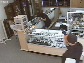 Kingston Police released store security photos of an attempted robbery at Khean Vinh Jewellery store on Wednesday afternoon.