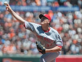 Cincinnati Reds starting pitcher Homer Bailey (34) throws a pitch against the San Francisco Giants during the first inning at AT&T Park on Jun 29, 2014 in San Francisco, CA, USA. (Ed Szczepanski/USA TODAY Sports)