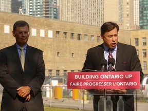 Economic Development Minister Brad Duguid, right, with Bob Peter, President and CEO of the LCBO, said the government is now entertaining bids from developers to purchase a four-hectare (11 acre) site owned by the Liquor Control Board of Ontario on Sept. 4, 2014. (Jack Boland/Toronto Sun)