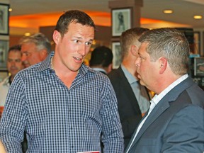 Leafs captain Dion Phaneuf (left), chatting with GM Dave Nonis during a June fund-raiser, had a productive one-on-one with new team president Brendan Shanahan in P.E.I. (Craig Robertson, Toronto Sun)