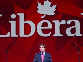 Justin Trudeau in front of Liberal sign. (JOEL LEMAY/QMI Agency)