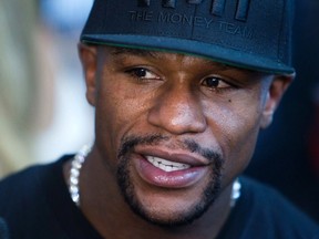 WBC/WBA welterweight champion Floyd Mayweather Jr. of the U.S. speaks to reporters during a media day at the Mayweather Boxing Club in Las Vegas, Nevada September 2, 2014. (REUTERS/Las Vegas Sun/Steve Marcus)