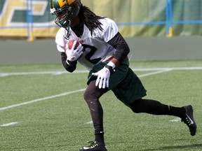 Fred Stamps carries the ball during practice Thursday at Commonwealth Stadium. (Perry Mah, Edmonton Sun)