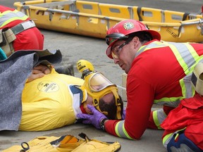 JOHN LAPPA/THE SUDBURY STAR/QMI AGENCY
Vale's East Mines Rescue Team demonstrates their skills during a mock mine rescue at Vale's Stobie Mine Complex in Sudbury, ON. on Thursday, Sept. 4, 2014. Vale's East Mines Rescue Team was honoured at a ceremony prior to the demonstration. The team is heading to the International Mine Rescue Competition in Poland from Sept. 6-13. In June, the team won the overall Provincial Mine Rescue Competition and the First Aid Award. This is the first time a team from Vale has competed in the international competition. There are 23 teams from 20 countries competing in Poland.