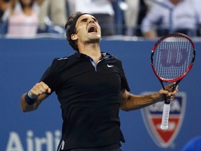 Roger Federer of Switzerland celebrates defeating Gael Monfils of France in the fifth set of their quarter-final men's singles match at the 2014 U.S. Open tennis tournament in New York, September 4, 2014. (REUTERS/Mike Segar)