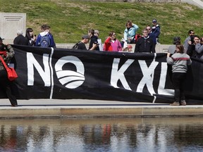 Members of the Cowboys and Indian Alliance, a group of ranchers, farmers and indigenous leaders, participate in protests against the Keystone XL pipeline at the Reflection Pool in front of the Lincoln Memorial in Washington on April 24, 2014. (REUTERS/Gary Cameron)